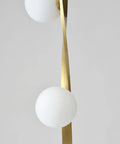 Close-up of twisting stem on Nola Mid Century Modern 3 Globe Floor Lamp For Living Room And Office, gold finish detail.