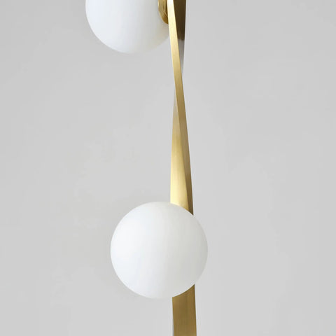 Close-up of twisting stem on Nola Mid Century Modern 3 Globe Floor Lamp For Living Room And Office, gold finish detail.