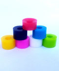 Colorful 85A cushions for quad roller skating. Includes black four high rebound cushions and four step top cushions for PowerDyne Reactor.