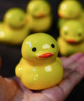 Sweet Ceramic Duck Toilet Bolt Covers For A Fresh Bath Swap Dope Screw Caps With Easy Install And Zero Fuss Upgrades Your Sanitary Hardware Today, showcased in a hand.