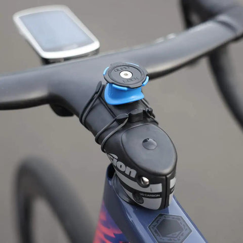 Flat Bar Adapter For Stem And Handlebar Bike Mount made from durable TPU with 3M adhesive on bike stem, close-up view, black