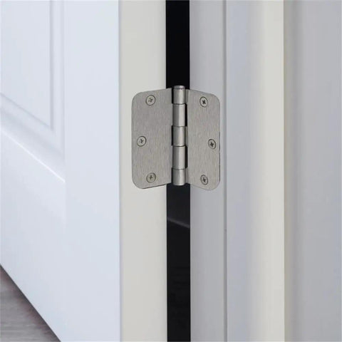 Close-up of 3.5 inch steel hinge in satin nickel finish installed on door, part of Brass Privacy Door Lever And 3 Pack Hinges set.