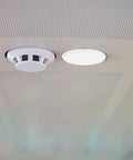 Concealed Premium Quality Fire Sprinkler Covers 2 Pack 3.34 Inch Round Ceiling Rings installed on ceiling showing concealed design.