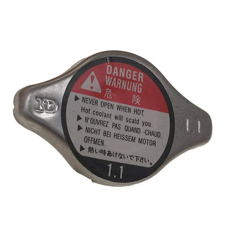 Honda Radiator Cap Compatible With 1994-2006 Accord, 1992-2005 Civic, side view showing warning label and 1.1 pressure rating