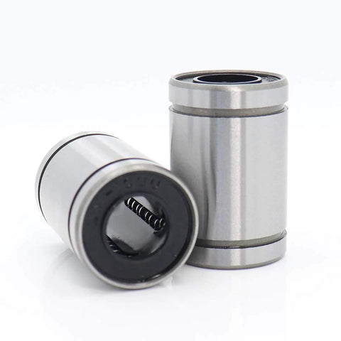 Two LM10UU linear bearings (10x19x29 mm) with black seals, side and front views