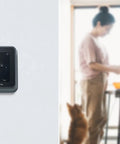 Smart Thermostat T5 Black ENERGY STAR Certified Cut Bills With Easy Temperature Control on wall with blurred background
