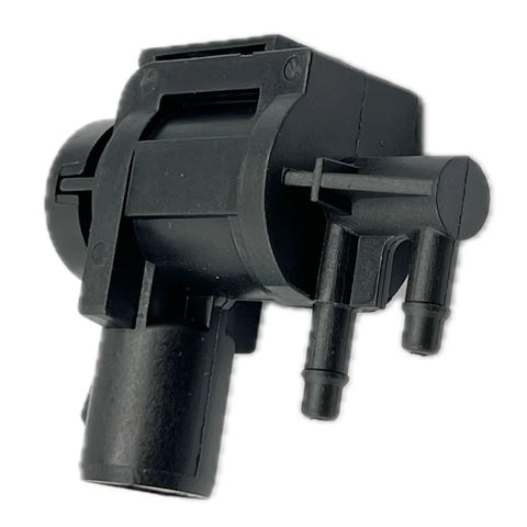 Front view of black plastic DEVMO 4x4 hub-lock vacuum solenoid actuator with dual hose fittings
