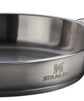 Stainless steel fry pan from Grub Ready All In One Camp Kitchen Gear 26 Piece Outdoor Cook Set With 4 Qt Pot Lid 8 Inch Fry Pan Plates Bowls Utensils Tableware BPA Free Ultra Durable Camping Essentials For Off Grid Meals.