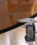 Thickness measurement of Dope Tempered Glass Lazy Susan Rotating Turntable shown with digital caliper at 10 mm