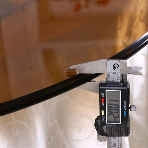 Thickness measurement of Dope Tempered Glass Lazy Susan Rotating Turntable shown with digital caliper at 10 mm