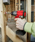 Using Straight Up Powerful Brushless Drill Driver Compatible With Milwaukee M12 12V Half Inch Cordless Power Tool Bare Unit to drill a hole.