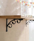 Heavy Duty L Shaped Shelf Brackets 2 Pack Wall Mounted Corner Braces For Indoor Outdoor Use supporting a wooden shelf