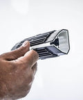 Person holding a tool from the High Strength Large Hole Repair Kit With Fiber Reinforced Spackling Compound, 3 to 5 inch wall and ceiling use