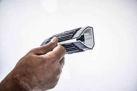 Person holding a tool from the High Strength Large Hole Repair Kit With Fiber Reinforced Spackling Compound, 3 to 5 inch wall and ceiling use