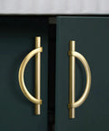Close-up of brushed gold half moon cabinet pulls 3.75 inch on green cabinet. Dope antique kitchen drawer handles, set of 8, zinc alloy.
