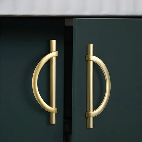 Close-up of brushed gold half moon cabinet pulls 3.75 inch on green cabinet. Dope antique kitchen drawer handles, set of 8, zinc alloy.