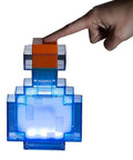 Potion Bottle Color Changing LED Desk Lamp With Pixelated Design, 7 Inch Night Light, hand touching top