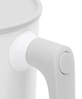 Close-up of the handle and button of the Next Level Smart Mug Warmer And Portable Beverage Cooler with Intelligent Temperature Control.
