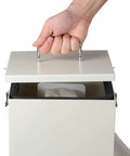 Hand lifting the lid of a Badass Lab Dust Collector 1000W Knockout Suction Vacuum showcasing interior fabric filter.