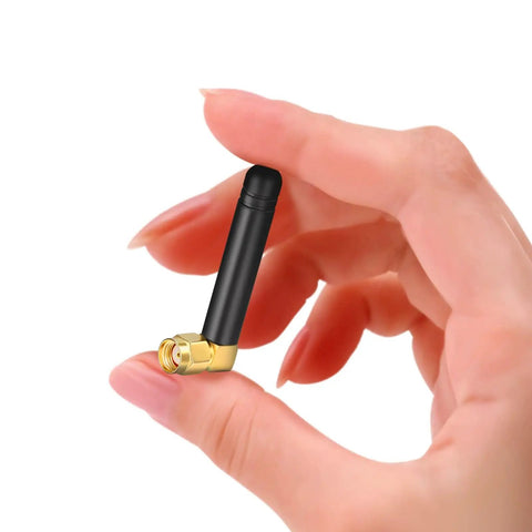 Hand holding Mini Dual Band WiFi Antenna 2.4GHz 5GHz 5.8GHz MIMO RP-SMA Male Right Angle, compact size shown in close-up