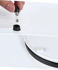 Close-up of connector being inserted into the base of the Sparkling 360 Rotating Turntable Display Stand For Jewelry Watches And Digital Products Mirror Base Electric Spin Platform Perfect For Retail Showcase Home Decor Or Modeling Tools Smooth ABS Construction.