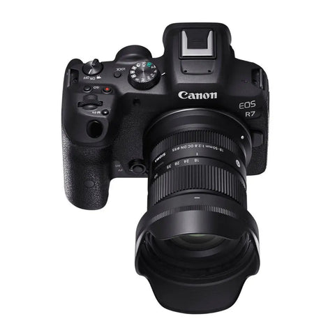 Front view of Canon EOS R7 with 18-50mm F2.8 DC DN Contemporary Lens For Canon RF Mount Mirrorless Cameras, lens attached.