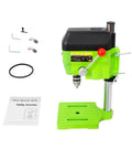 Built Different 480W Mini Bench Drill Press For Wood Metal PCB Tasks With Dual Speed Modes Compact Table Machine Heavy Duty DIY Shop Tool Locked In Quick Setup Ready showing green drill press with accessories.