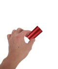 Hand holding a red PVC heat shrink cap for wine bottle sealing, part of Top Shelf Heat Shrink Wine Caps For Flawless Bottle Sealing Easy Peel Cork Covers Sweet Deal For Home Cellars And Casual Getaways Pro Grade Resealable Film Sleeves.