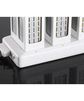 Phantom 4 Series Battery Charging Hub with three batteries in sequence, plug and play installation, white casing on black surface