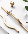 Golden Wave Shaped Cabinet Pulls Set Of 6 With Glossy Cupboard Drawer Knobs heavy duty elegant handles displayed on white surface