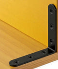 Tough As Nails Matte Black Stainless Steel L Brackets 3 By 3 Inch heavy duty corner brace securing yellow wood surface.