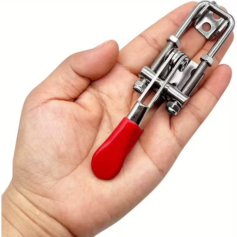 Person holding a Two Pack Self Locking 304 Stainless Steel Toggle Clamp For Quick Press Door Bolts And Box Fixtures Side Mount Hold Down Buckle Clamp Tool Durable Cabinet Door Hardware with red handle