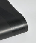 Close-up of Geometric Metallic Black Intersections Peel and Stick Wallpaper by Genevieve Gorder showing texture and finish.