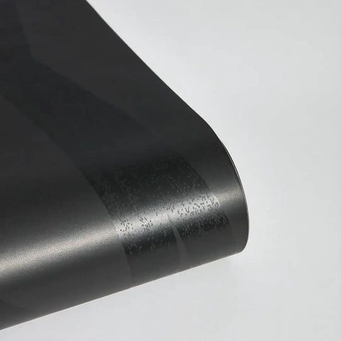 Close-up of Geometric Metallic Black Intersections Peel and Stick Wallpaper by Genevieve Gorder showing texture and finish.