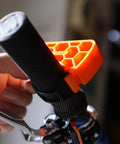Close-up of Clip On Bike Handlebar Stand Set for inverted parking and bike maintenance on a black bike grip.
