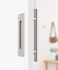 12 Pack Sliding Barn Door Handles Hardware Set With Flush Double Sided Finger Pull For Gates Garages And Cabinets Solid Steel Construction Powder Coated Finish Rust And Corrosion Resistant Smooth Touch No Sharp Edges Stainless Look installed on a white door.