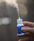 Killer Smoke Detector Wind Direction Indicator Powder Ultra Sensitive Tracking Dust For Testing Fire Alarms 1 Oz Odorless Cloud Container in hand.