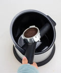 Badass Espresso Knock Box With Detachable Scraper And Shock Absorbent Base 700ML showing full bin with dirty espresso puck.