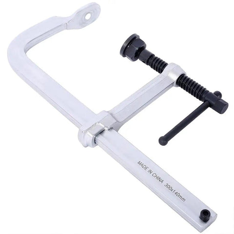 Heavy Duty 12 Inch F Clamp With Drop Forged Arm And Black Oxide Spindle For Woodworking Welding Metalworking DIY Projects With Quick Twist Pads That Hold Strong, close-up view showing clamp details.