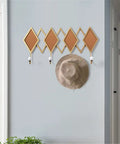 Real Deal Nordic Wrought Iron Wall Hooks For Coats And Keys Heavy Duty Build with decorative diamond design and hat.