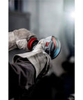 Worker using Beefy Four And A Half To Five Inch Angle Grinder With Eleven Thousand RPM And Twelve Amp Power AC DC Versatility Paddle Switch