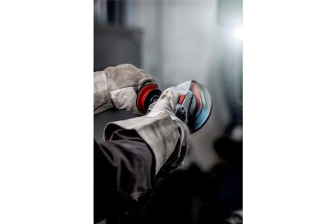 Worker using Beefy Four And A Half To Five Inch Angle Grinder With Eleven Thousand RPM And Twelve Amp Power AC DC Versatility Paddle Switch