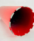Front view of a 6-inch red diamond core drill bit with segmented edge for concrete and masonry drilling