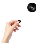 Compact Wireless Spy Cam With Crisp 4K Video And Seamless Night Vision, small camera held in hand for easy setup.