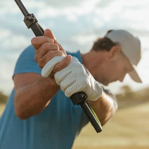 Golfer using Right Hand Golf Swing Training Aid That Improves Clubface Awareness, Swing Plane, And Impact For Consistent Distance