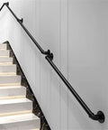 Industrial Water Pipe Stair Handrail Heavy Duty Wrought Iron Banister With Locking Brackets Straightforward Wall Mount For Lofts Attics Built Tough No Sweat Setup on stairs with modern backdrop.