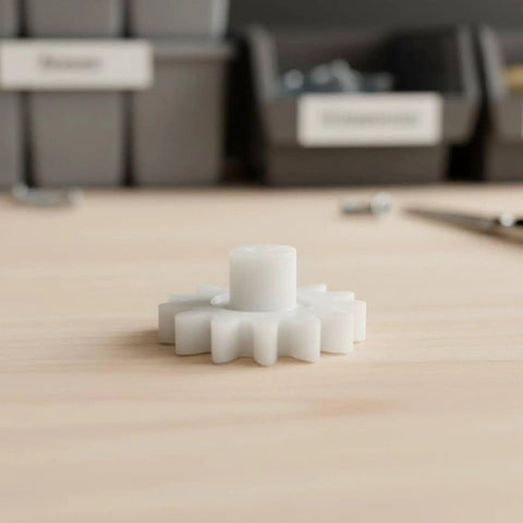 Kids DIY Gear Kit For Hands On Precision Engineering Small Gear Drive Wheel Cog With 2mm Bore 10 Teeth Regular Size Ideal STEM Projects Educational Toys And Tiny Mechanical Prototypes white plastic gear on wooden table