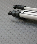 Tripod on coin pattern rubber flooring 3.5mm thick 36 inch by 10 foot sheet dark gray no slip surface for garage and shop durable thermoplastic rubber