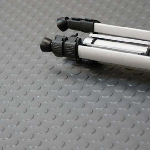 Tripod on coin pattern rubber flooring 3.5mm thick 36 inch by 10 foot sheet dark gray no slip surface for garage and shop durable thermoplastic rubber