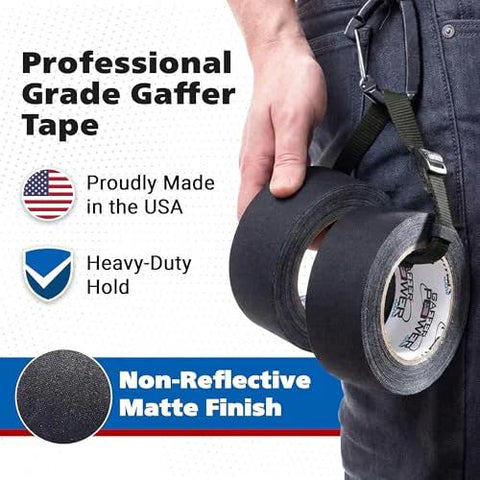 Gaffer tape roll front view, 2 in x 30 yd, black, non-reflective matte finish, held on a worker’s belt.
